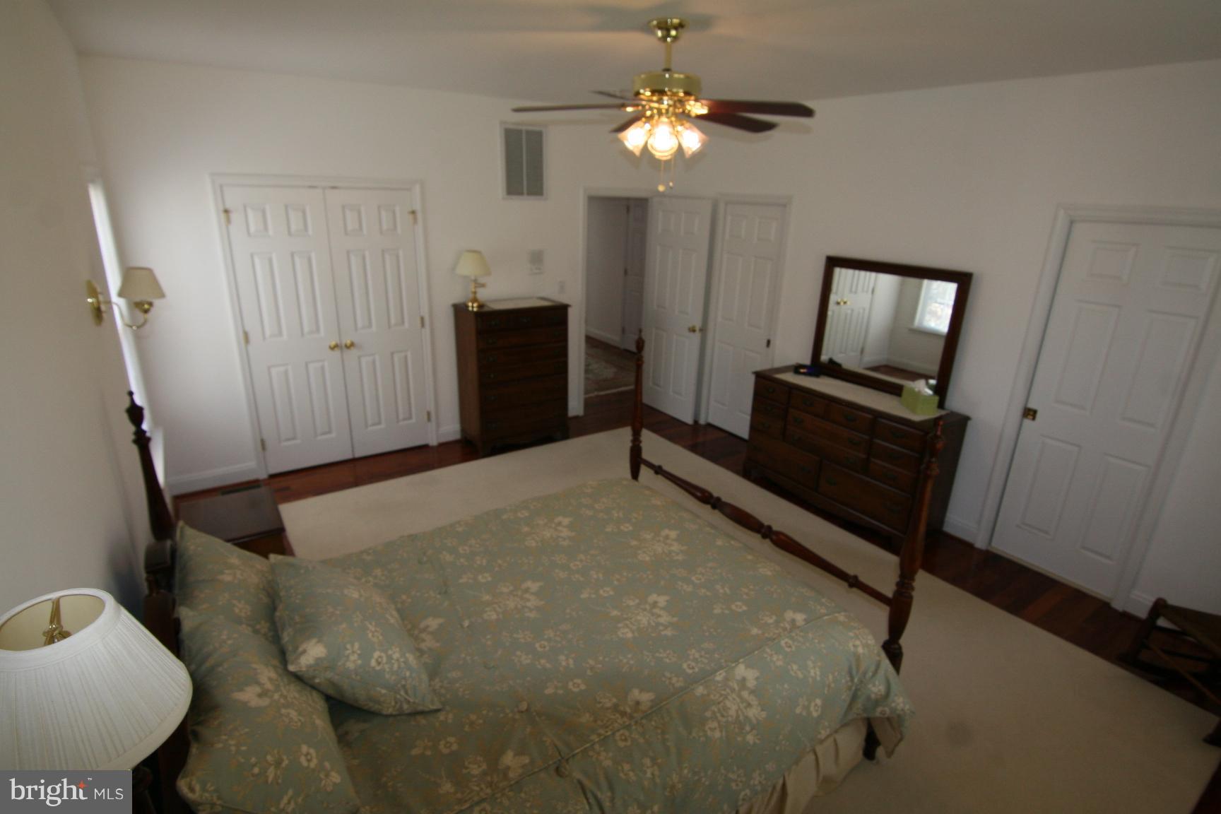 3535 Yellow Bank Road Dunkirk, MD 20754 - Photo 17 of 25 a bedroom with a bed and a chandelier
