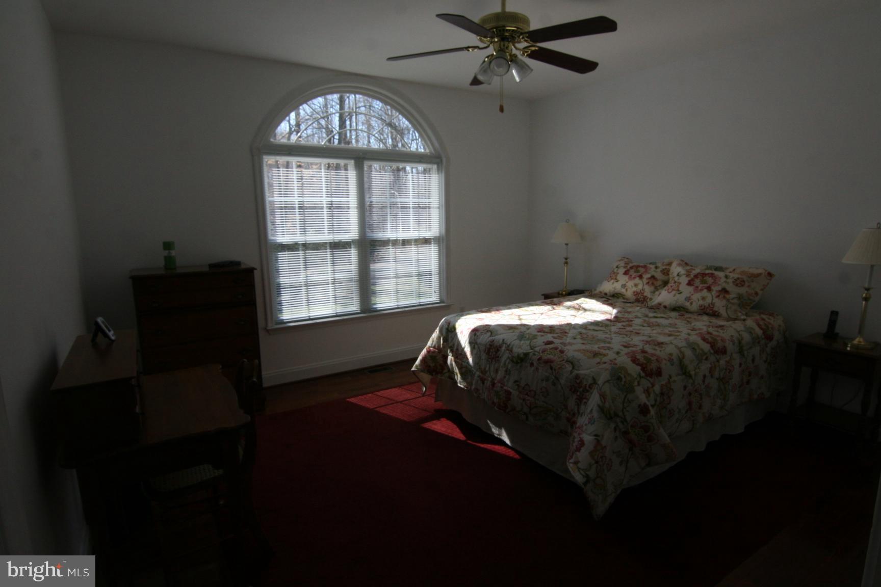 3535 Yellow Bank Road Dunkirk, MD 20754 - Photo 22 of 25 a bed sitting in a bedroom next to a window