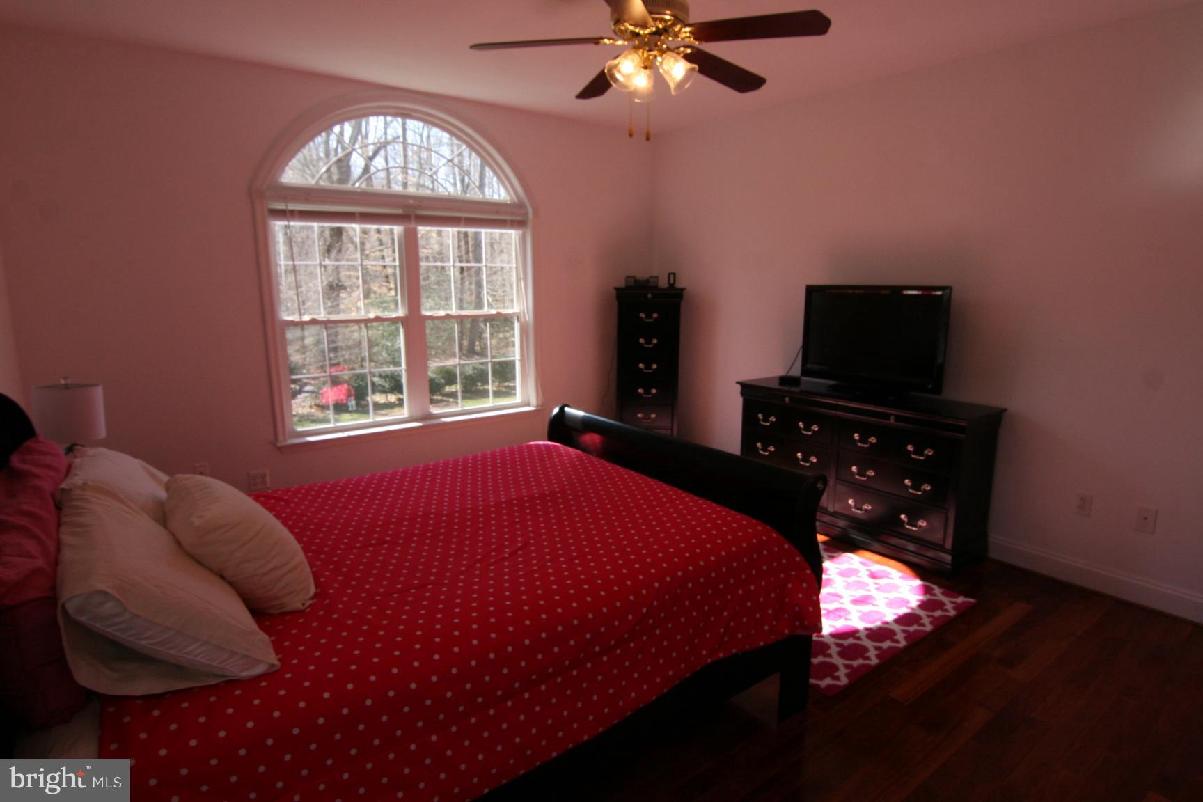 3535 Yellow Bank Road Dunkirk, MD 20754 - Photo 23 of 25 a bedroom with a bed and a chandelier