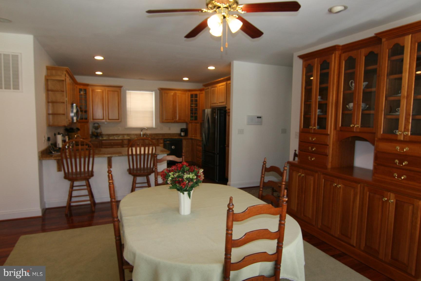 3535 Yellow Bank Road Dunkirk, MD 20754 - Photo 10 of 25 a view of a dining room with furniture window and wooden floor