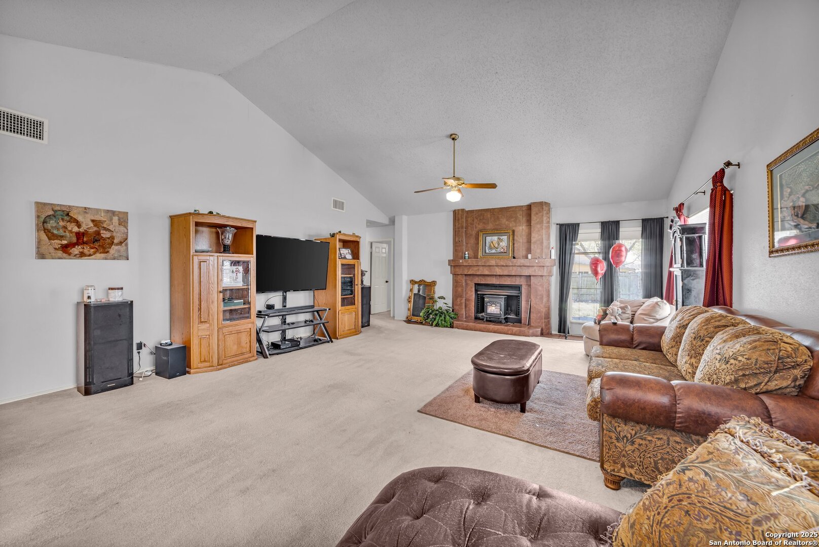 8746 Serene Ridge Drive San Antonio, TX 78239 - Photo 4 of 18 a living room with furniture and a fireplace