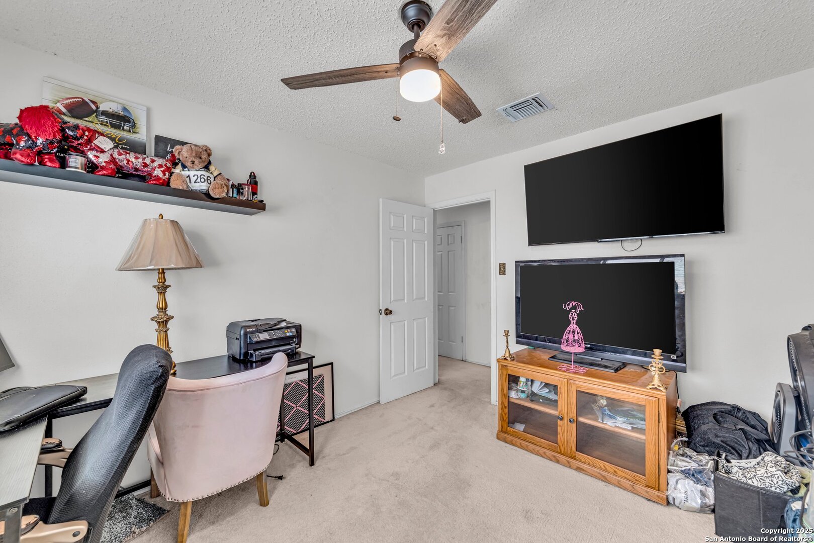 8746 Serene Ridge Drive San Antonio, TX 78239 - Photo 9 of 18 a room with furniture and a flat screen tv