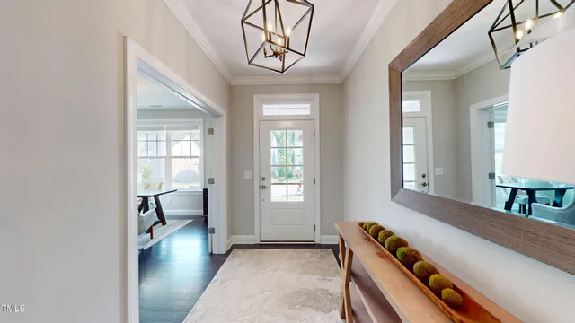 a living room with furniture and a book shelf