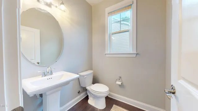 a view of a dining area with furniture window and wooden floor