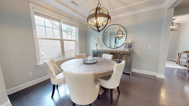 a living room with furniture and a clock