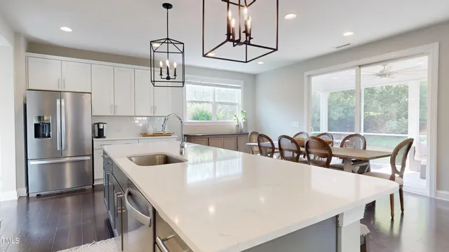 a kitchen with a refrigerator and cabinets