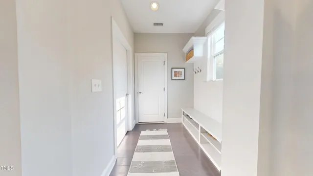 a bathroom with a double vanity sink toilet and shower
