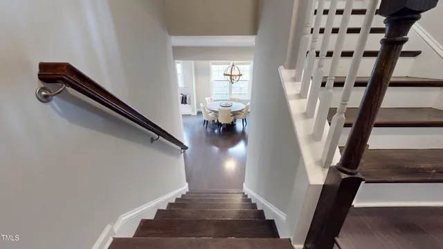 a bathroom with a bathtub sink and mirror