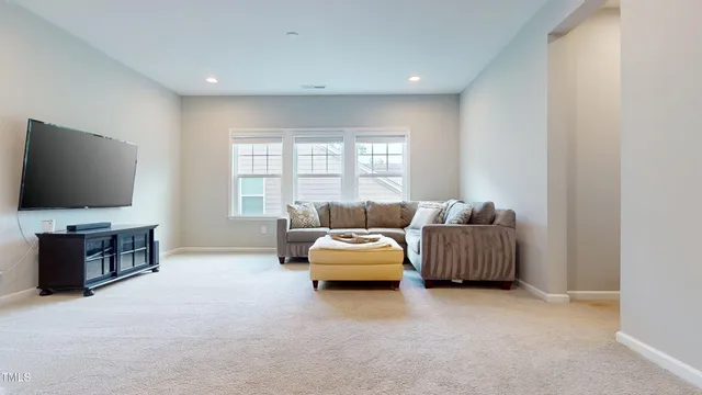 a white bath tub sitting in a bathroom next to a window