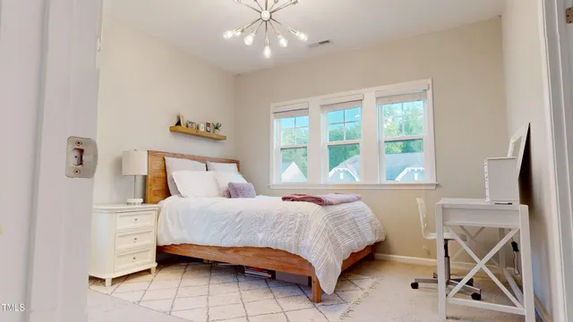 a bathroom with a granite countertop sink a toilet and a mirror