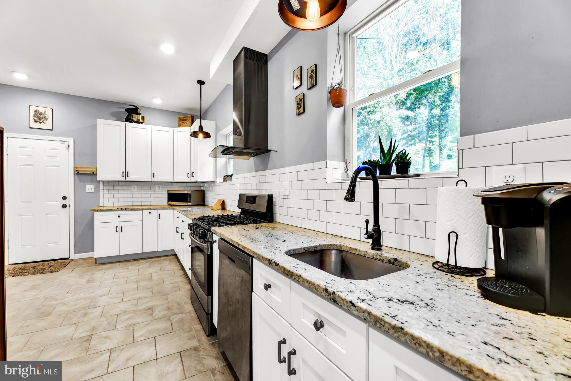 2607 Talbot Road Baltimore, MD 21216 - Photo 17 of 37 Granite counters and ceramic tile flooring