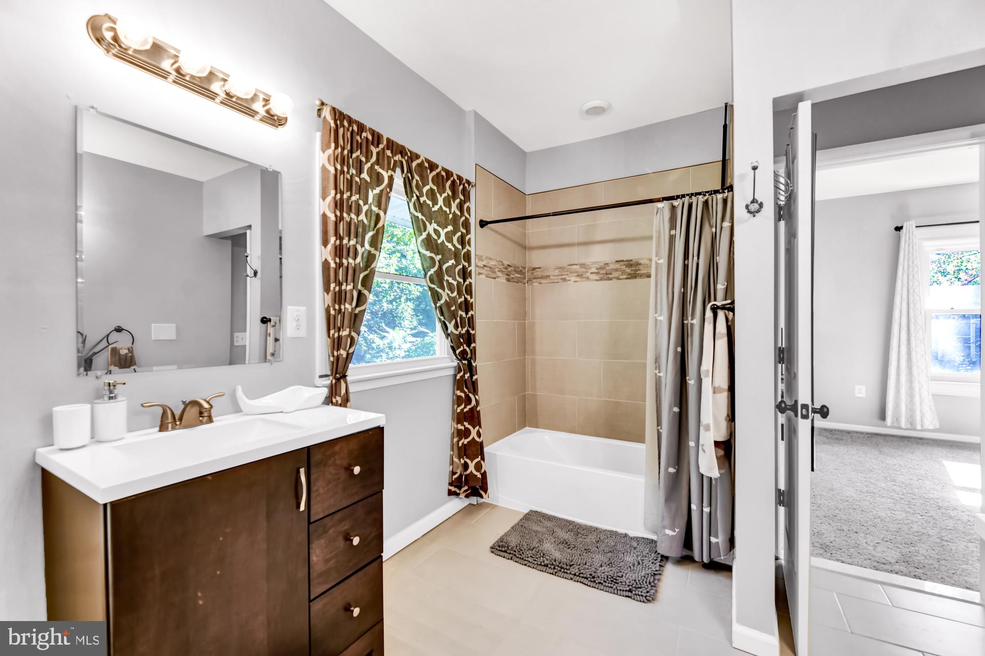 2607 Talbot Road Baltimore, MD 21216 - Photo 27 of 37 2nd Floor Hall Bath, BR 2 beyond