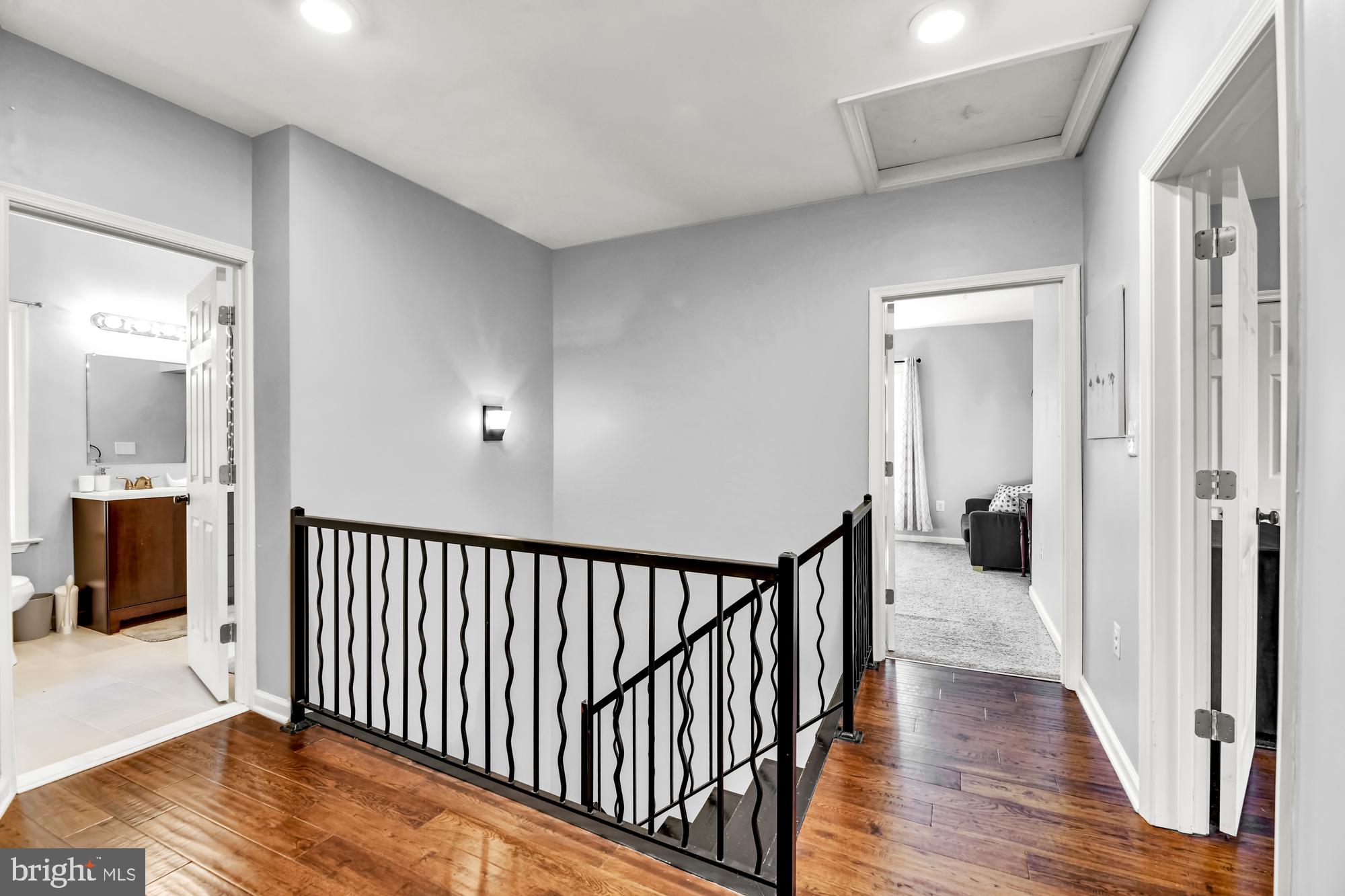 2607 Talbot Road Baltimore, MD 21216 - Photo 29 of 37 Stair landing, 2nd floor w/ wrought iron rails.