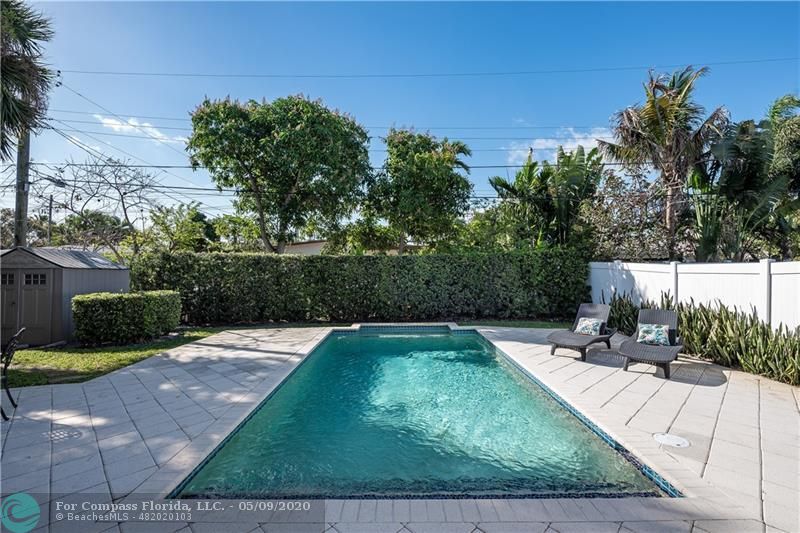 Spacious fenced-in backyard with sparkling pool!