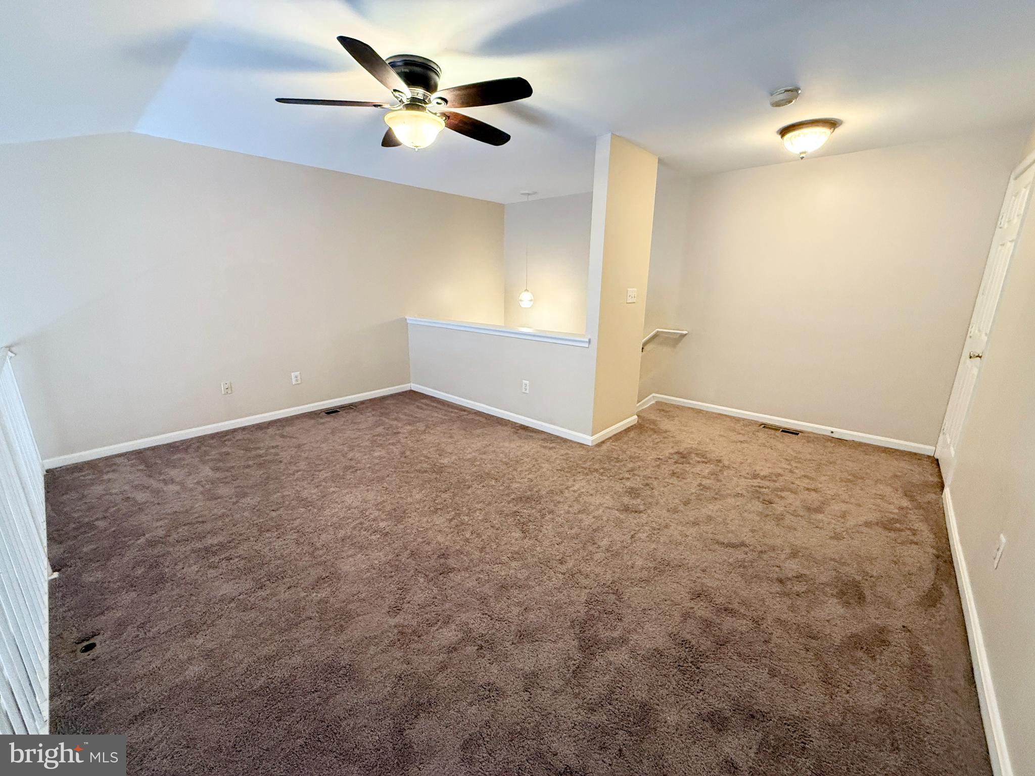 9211 Azure Court, Unit 202 Manassas, VA 20110 - Photo 13 of 16 an empty room with windows and fan