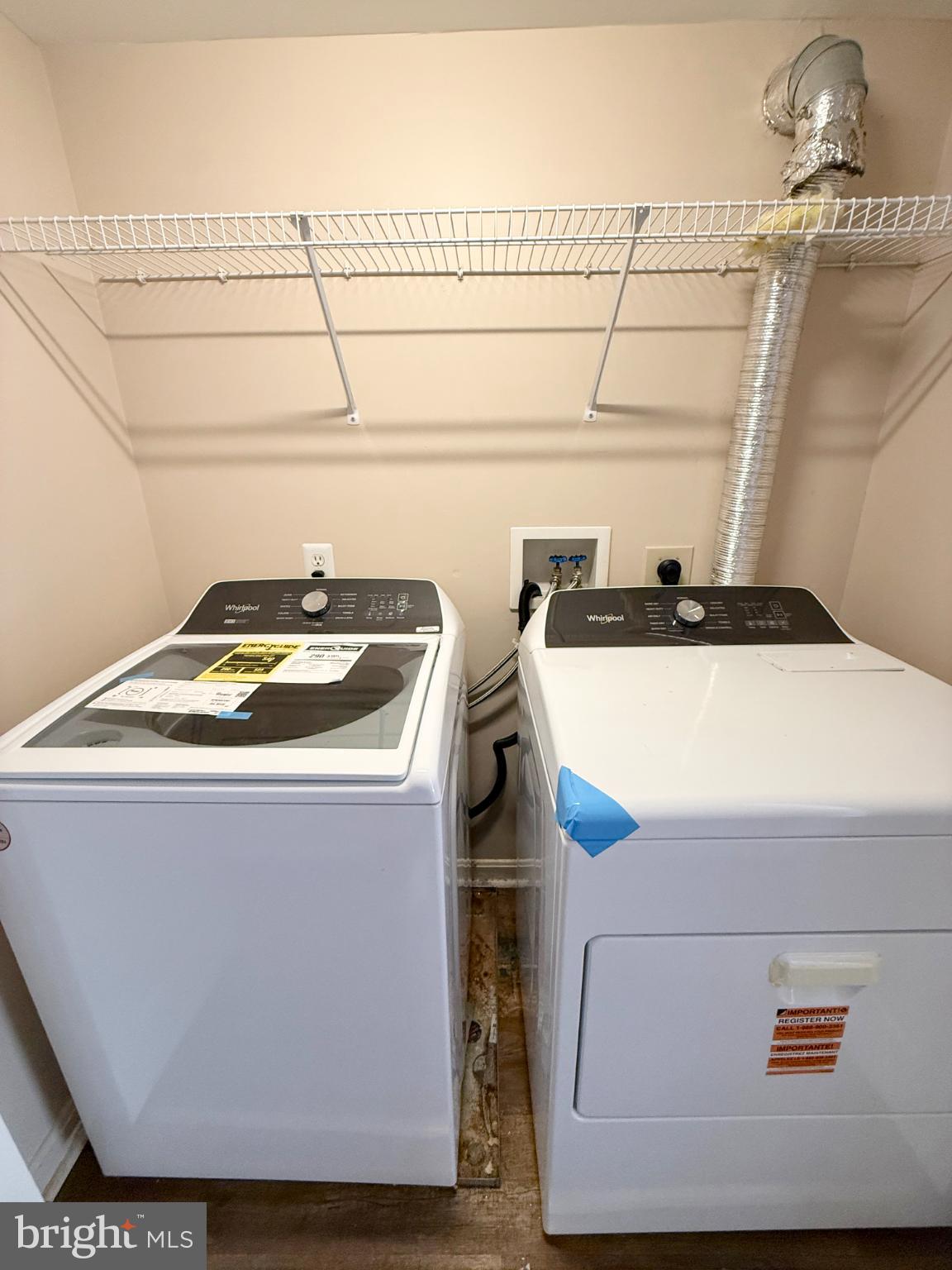 9211 Azure Court, Unit 202 Manassas, VA 20110 - Photo 15 of 16 a utility room with dryer and washer