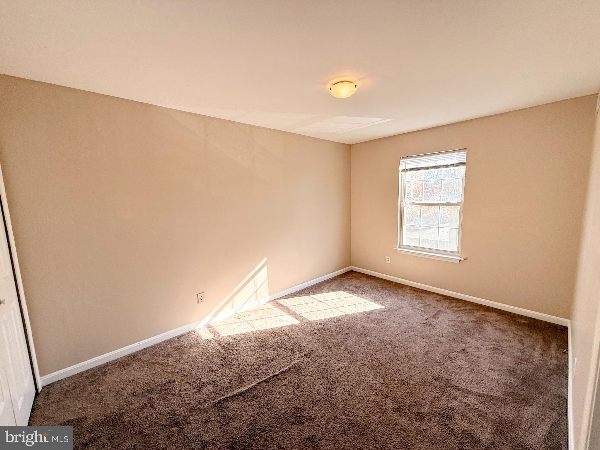 9211 Azure Court, Unit 202 Manassas, VA 20110 - Photo 9 of 16 an empty room with windows