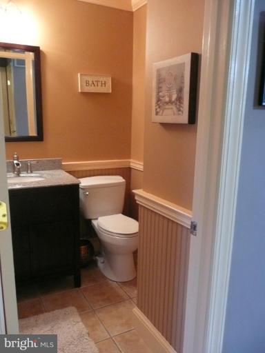 3205 Breckenridge Way Riva, MD 21140 - Photo 13 of 30 a bathroom with a toilet sink and mirror