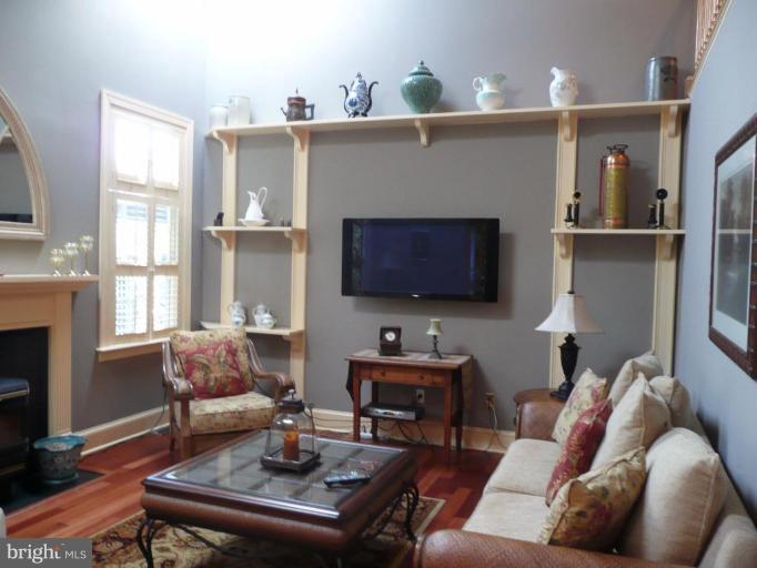3205 Breckenridge Way Riva, MD 21140 - Photo 14 of 30 a living room with furniture a fireplace and a flat screen tv