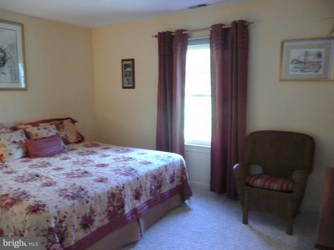 3205 Breckenridge Way Riva, MD 21140 - Photo 17 of 30 a bedroom with a bed chair and a window