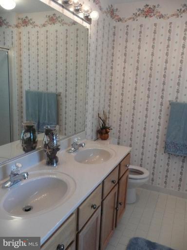 3205 Breckenridge Way Riva, MD 21140 - Photo 22 of 30 a bathroom with a double vanity sink and a mirror