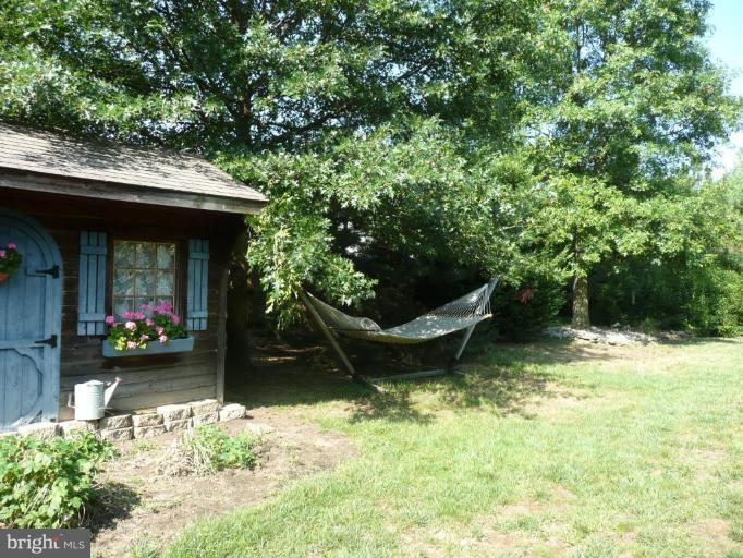 3205 Breckenridge Way Riva, MD 21140 - Photo 28 of 30 a view of a wooden house with a yard and sitting area
