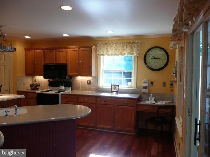 3205 Breckenridge Way Riva, MD 21140 - Photo 4 of 30 a kitchen with a sink cabinets and wooden floor