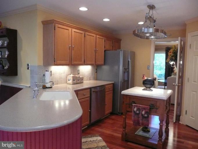 3205 Breckenridge Way Riva, MD 21140 - Photo 6 of 30 a kitchen with kitchen island granite countertop a sink stove and refrigerator