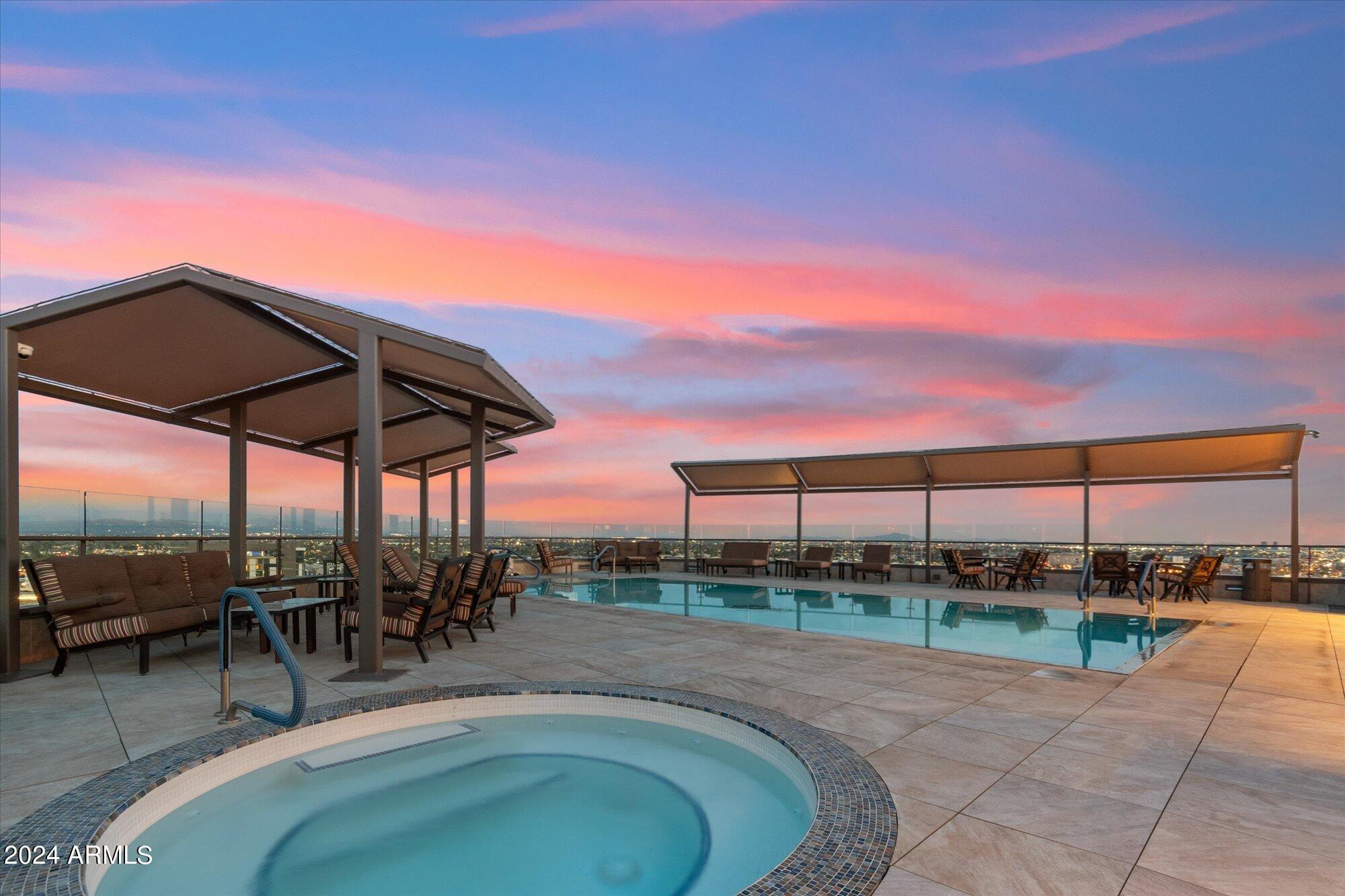 7181 East Camelback Road, Unit 206 Scottsdale, AZ 85251 - Photo 19 of 28 a view of a swimming pool with a patio
