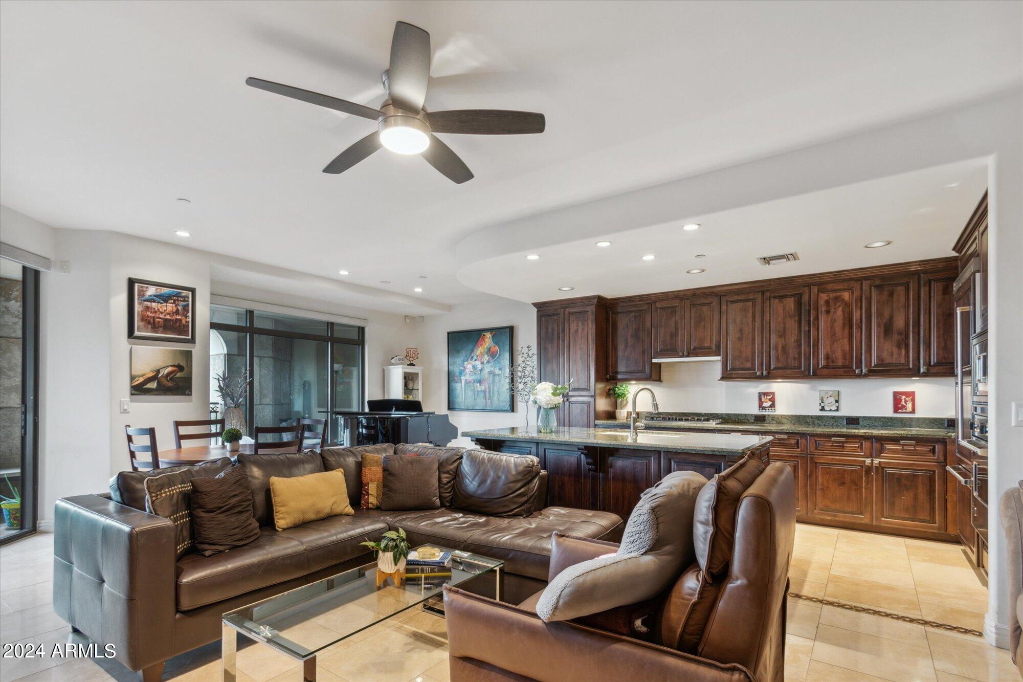 7181 East Camelback Road, Unit 206 Scottsdale, AZ 85251 - Photo 4 of 28 a living room with stainless steel appliances kitchen island furniture and a view of kitchen