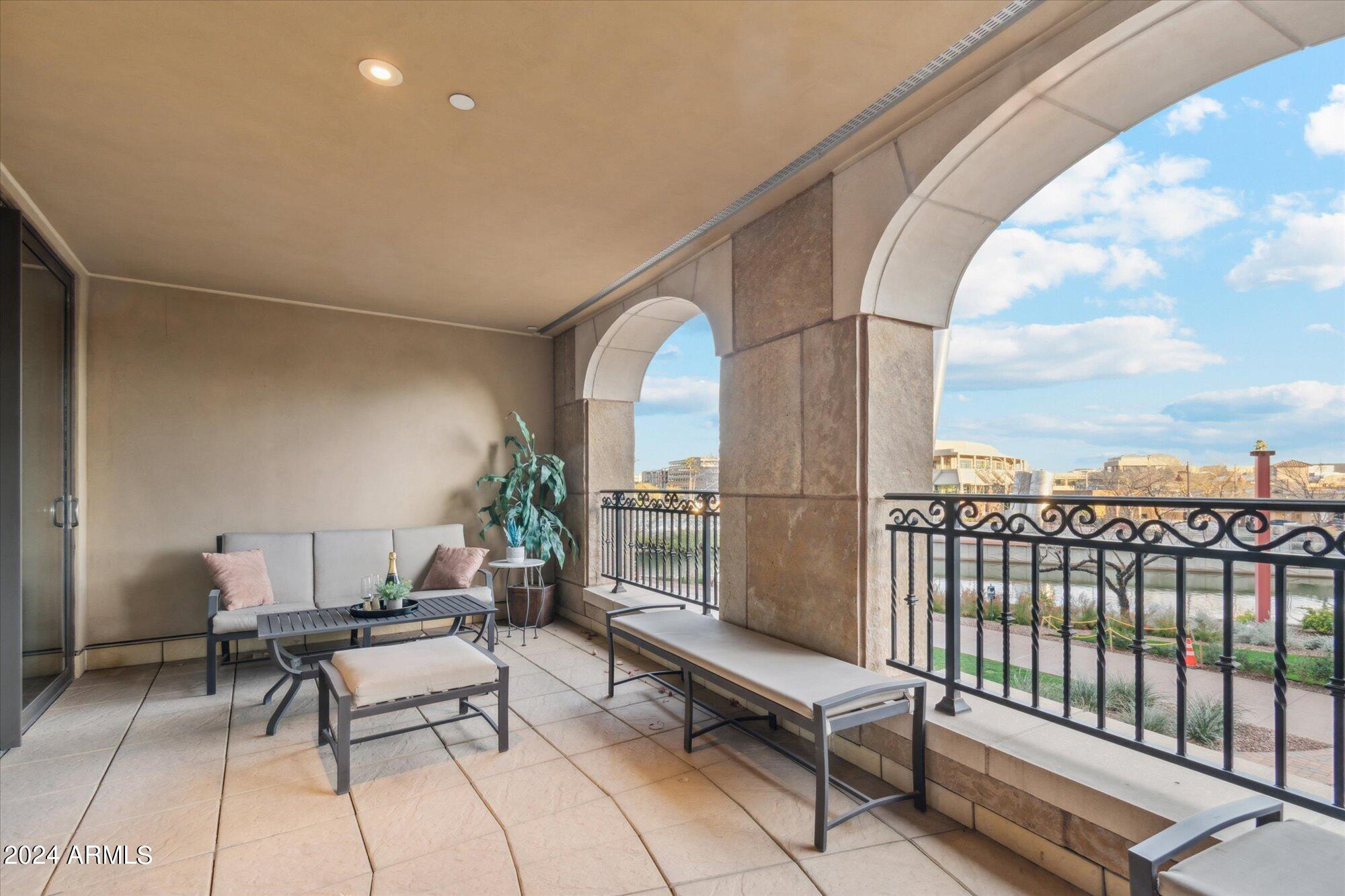 7181 East Camelback Road, Unit 206 Scottsdale, AZ 85251 - Photo 8 of 28 a roof deck with couch and chairs