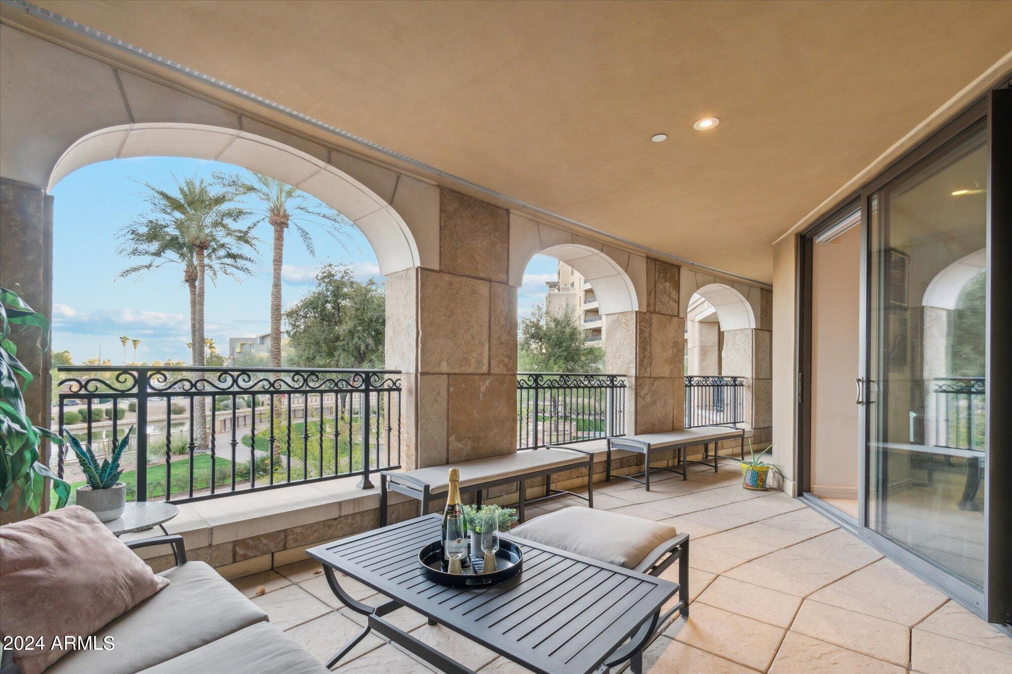 7181 East Camelback Road, Unit 206 Scottsdale, AZ 85251 - Photo 9 of 28 a living room with furniture and a large window