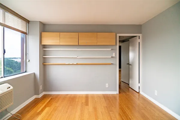 a view of an empty room with a window