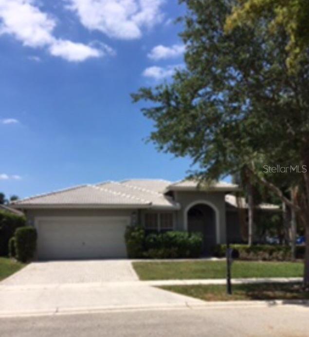 22122 Braddock Place Boca Raton, FL 33428 - Photo 1 of 1 a view of a house with a yard