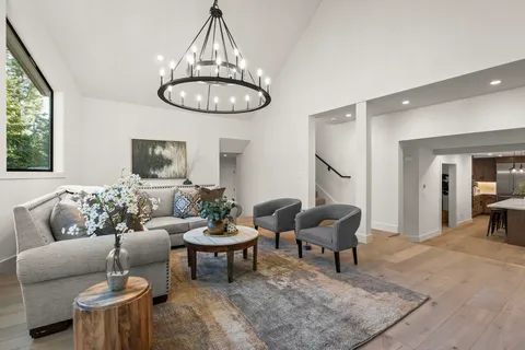 a living room with furniture a window and a dining table
