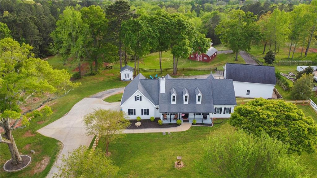 1910 Double Springs Church Road Monroe, GA 30656 - Photo 1 of 1 a view of house with garden space and trees