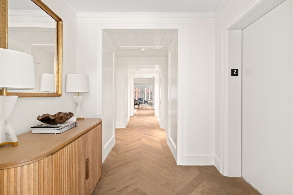 397 Commonwealth Avenue, Unit 2 Boston, MA 02215 - Photo 13 of 23 a view of a hallway to a livingroom with a window
