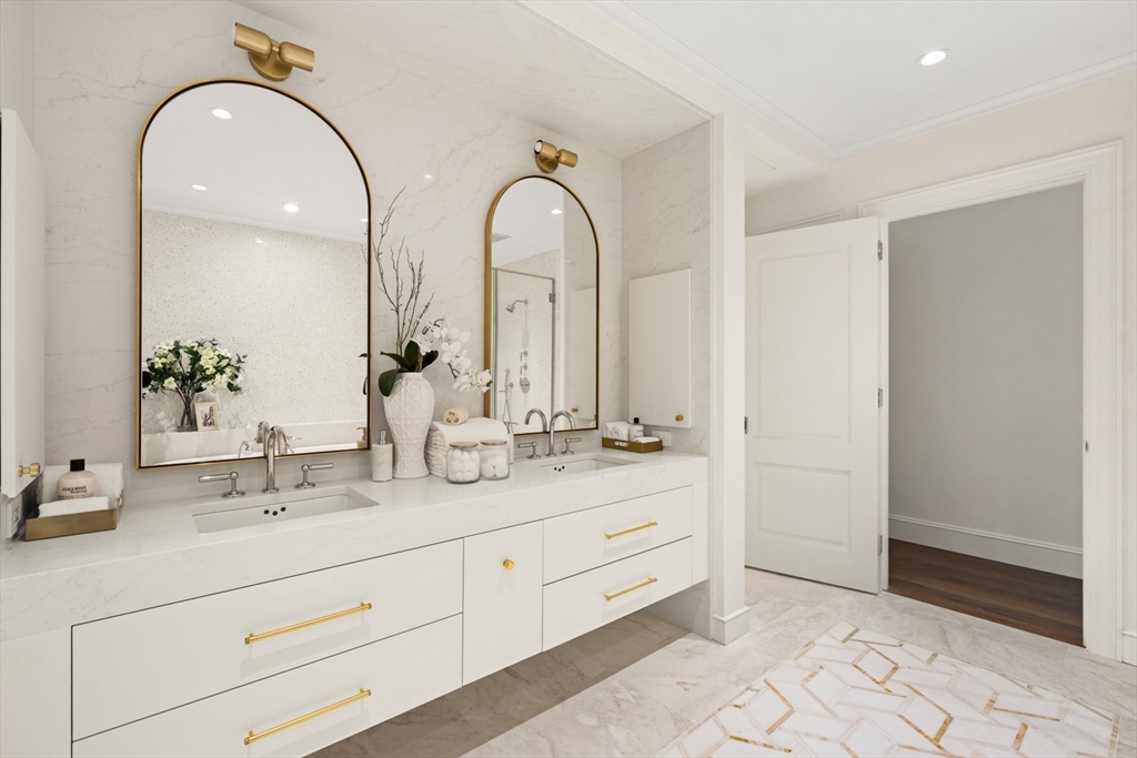 397 Commonwealth Avenue, Unit 2 Boston, MA 02215 - Photo 17 of 23 a bathroom with a double vanity sink and a mirror