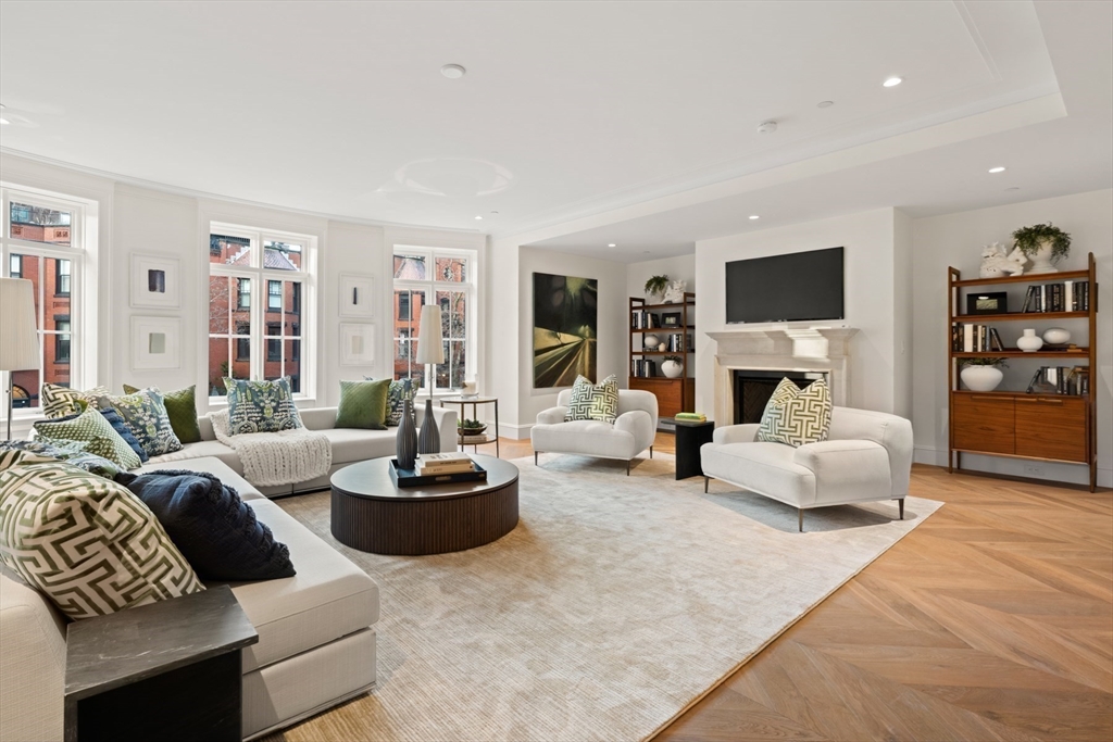 397 Commonwealth Avenue, Unit 2 Boston, MA 02215 - Photo 2 of 23 a living room with fireplace furniture and a flat screen tv