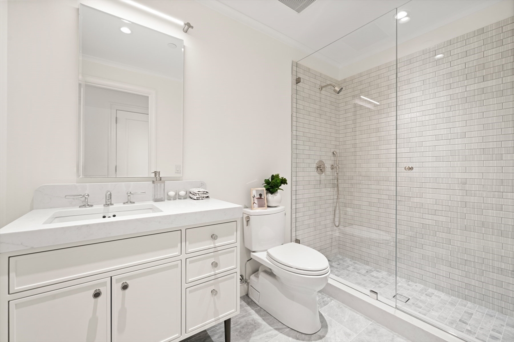 397 Commonwealth Avenue, Unit 2 Boston, MA 02215 - Photo 21 of 23 a bathroom with a toilet sink a shower and