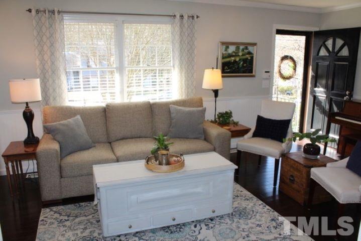 1012 Mockingbird Drive Raleigh, NC 27615 - Photo 3 of 26 a living room with furniture and a window