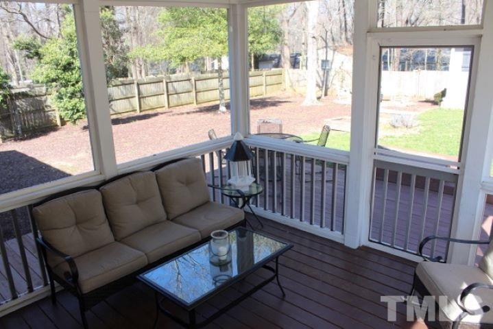 1012 Mockingbird Drive Raleigh, NC 27615 - Photo 22 of 26 a living room with wooden floor and a window