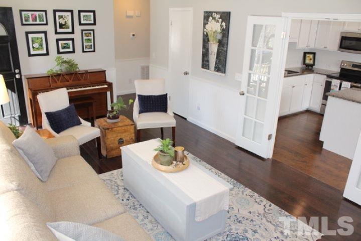 1012 Mockingbird Drive Raleigh, NC 27615 - Photo 5 of 26 a living room with furniture and wooden floor