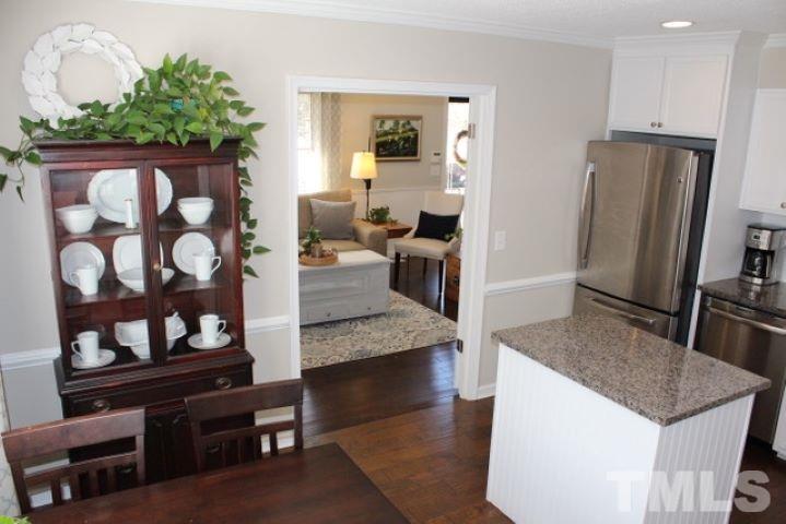 1012 Mockingbird Drive Raleigh, NC 27615 - Photo 8 of 26 a view of kitchen island with wooden floor