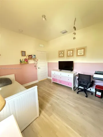 a view of a hallway with washer and dryer