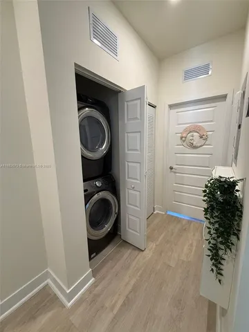 a view of balcony with wooden floor