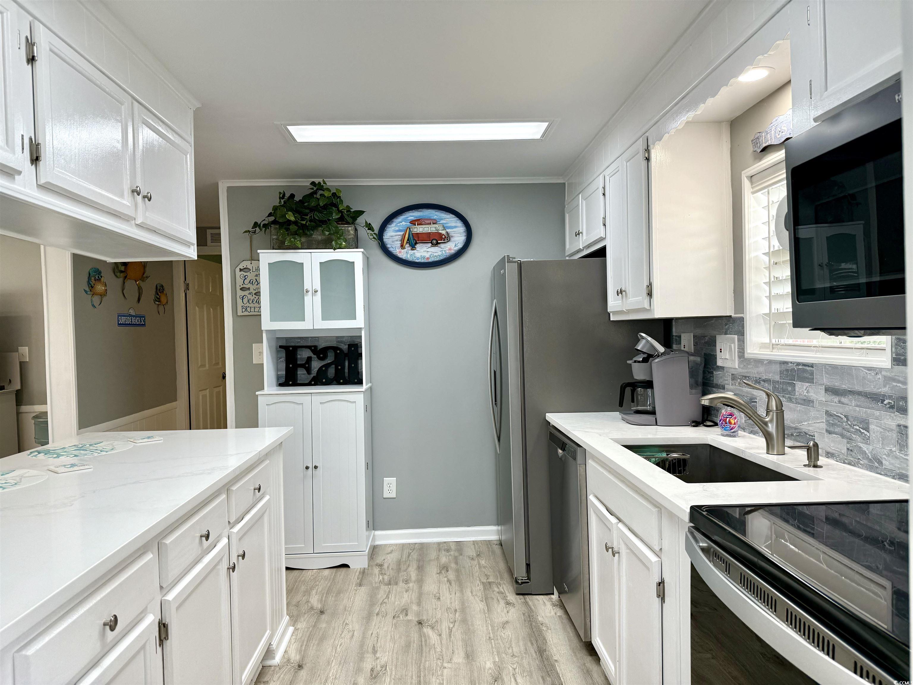 523 Sandpebble Surfside Beach, SC 29575 - Photo 11 of 31 Kitchen with appliances with stainless steel finis