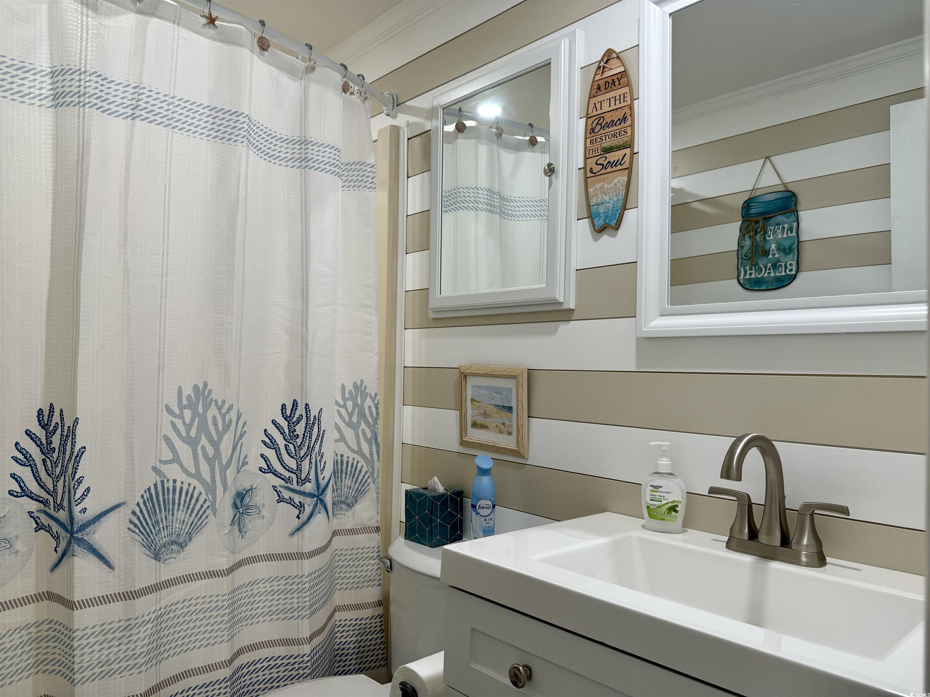 523 Sandpebble Surfside Beach, SC 29575 - Photo 14 of 31 Bathroom featuring ornamental molding, toilet, van