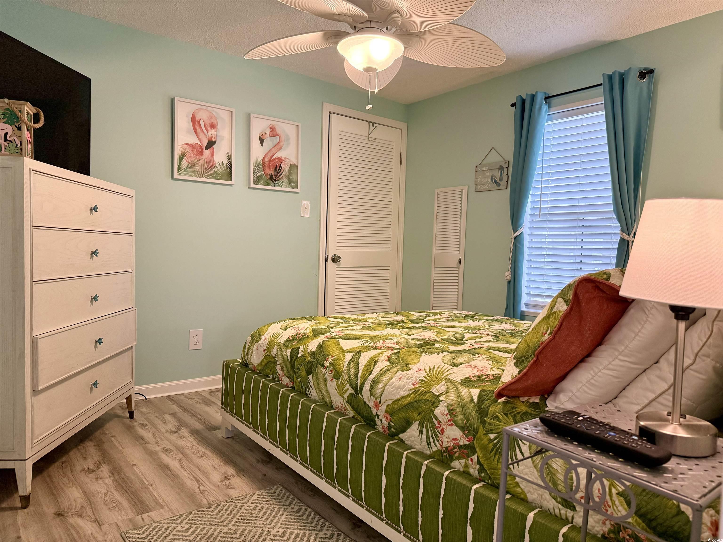 523 Sandpebble Surfside Beach, SC 29575 - Photo 15 of 31 Bedroom featuring ceiling fan and light hardwood /