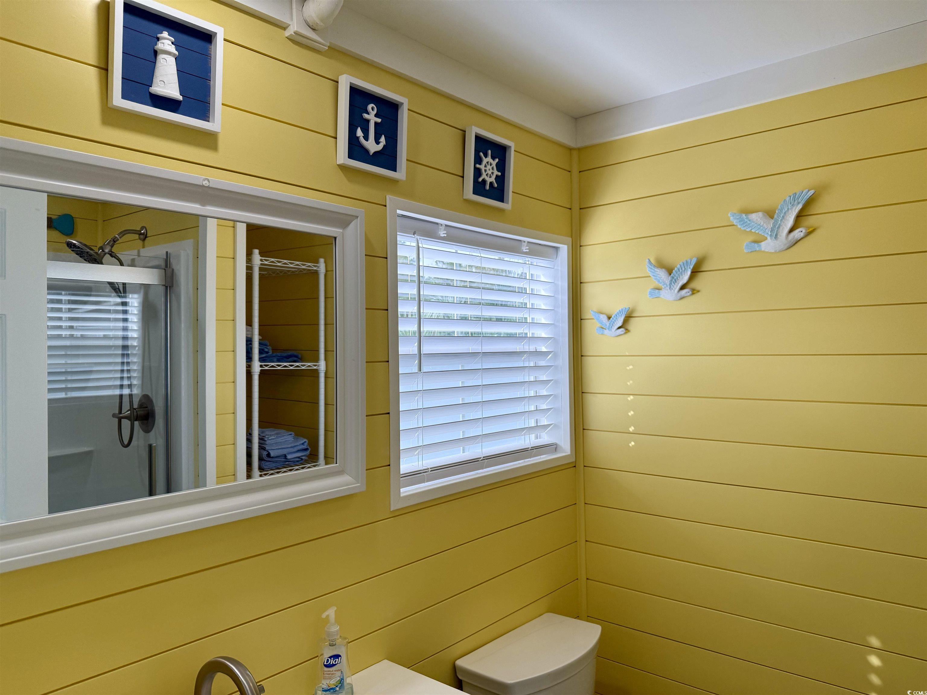 523 Sandpebble Surfside Beach, SC 29575 - Photo 21 of 31 Bathroom featuring wooden walls, walk in shower, a